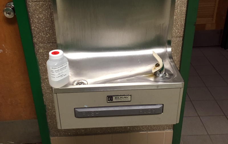 Image of water fountain and water sampling container