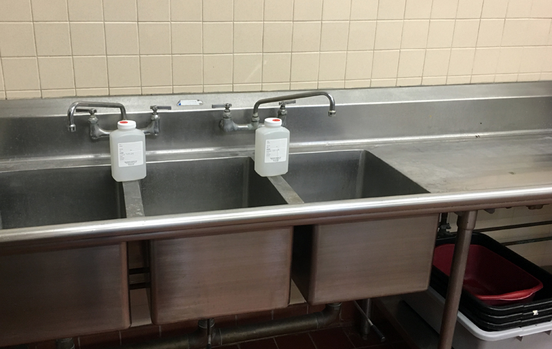 Image of sink and water sampling container